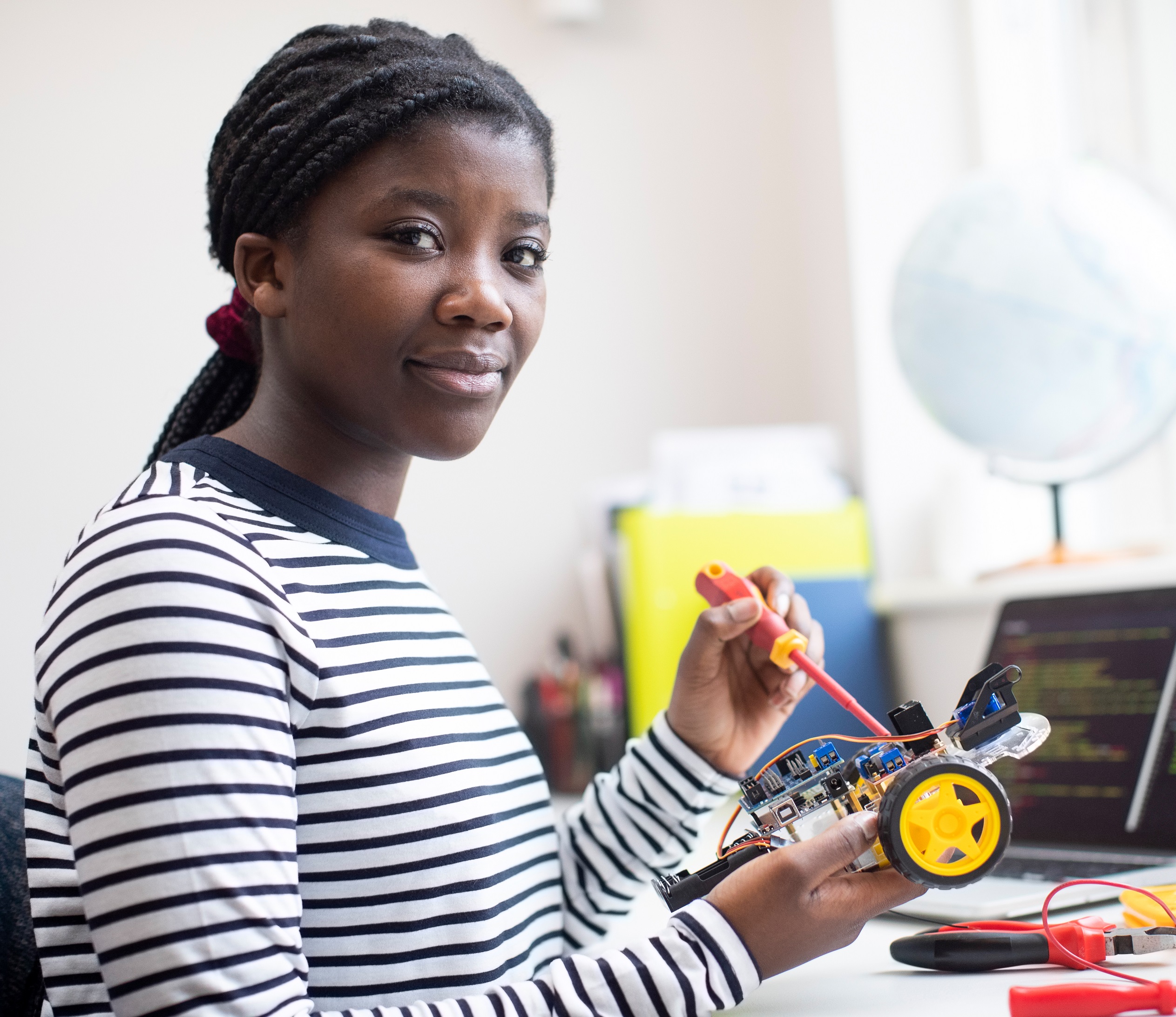 young woman building a device